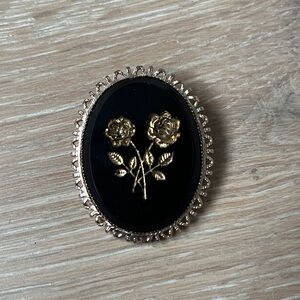 Elegant Black and Gold Floral Brooch